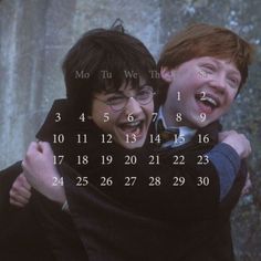 two young men hugging each other in front of a wall calendar with the words harry potter on it