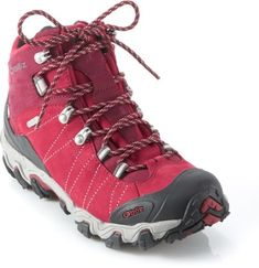 a pair of red hiking boots with laces on the outstep and heel