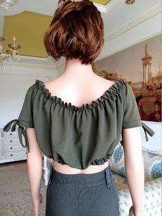 "womens Top womens Crop Top dirndl top green Blouse green Top Khaki Blouse festival top Octoberfest Blouse Victorian top Renaissance Blouse XL 95%-polyester; 5%-elastane made in UK Please refer to photos for details of condition. Condition: very good vintage Measurements: Length: 28cm/11.0\" Sleeve : 18 cm/7.1\" Bust: 102 cm/40.1\" Waist: 90cm/35.4\" Tag Size: UK-16; EUR-44 note The color on the pictures may vary due to monitor settings and light reflections. Ready to ship Please do not hesitate Fitted Dark Green Top For Spring, Green Peasant Top For Summer, Green Peasant Blouse For Summer, Summer Peasant Top In Green, Fitted Khaki Summer Blouse, Summer Green Peasant Tops, Fitted Khaki Blouse For Summer, Green Fitted Crop Top Blouse, Fitted Green Crop Top Blouse