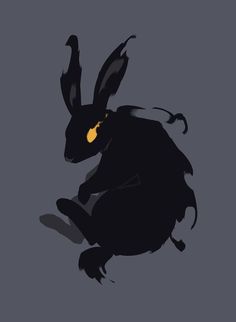 a black rabbit with yellow eyes sitting on the ground in front of a gray background