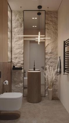 a modern bathroom with stone walls and flooring