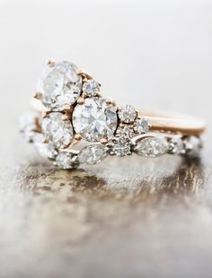 an antique diamond ring is shown on a table