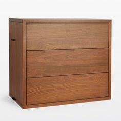 a wooden dresser with three drawers on wheels and no handles, against a white background