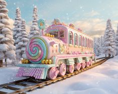 a pink train traveling through a snow covered forest