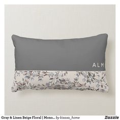 a gray and white floral pillow with the name alexandria on it's front side