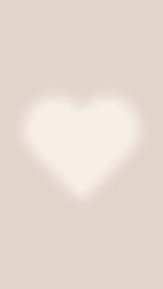 a white heart shaped object on a light gray background with the word love written below it