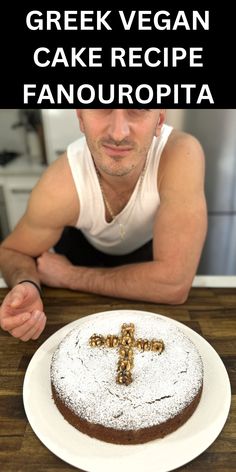 a man sitting at a table with a cake in front of him and the words greek vegan cake recipe fanouropita on it