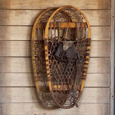 an old wooden sled hanging on the side of a building next to a door