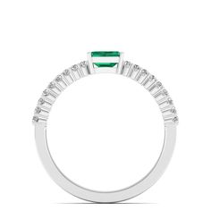 This exquisite emerald diamond ring in a stunning piece of jewelry that exudes elegance and sophistication. The vibrant emerald gemstone is beautifully complemented by the sparkling diamonds set in a lustrous white gold band, creating a timeless and luxurious look that is perfect for any special occasion. Metal: 14K Gold Setting Type: Prong Rhodium Finish: Yes, on White Gold Gemstone Details: Gemstone: Emerald Shape: Emerald Cut Average Dimensions: 5.00 x 3.00 MM Quantity: 01 Average Cut: Very G White Emerald Ring With Prong Setting, Emerald And Diamond Band, Dance Jewelry, Emerald Diamond Ring, Birthstone Gifts, Ring Pendant Necklace, White Gold Band, Emerald Gemstone, Diamond Band