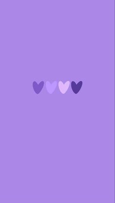 three hearts on a purple background