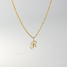 A timeless piece that will never go out of style. This 14K gold calligraphy pendant is the perfect and most stunning way of keeping a name close to your heart. We handmade each piece so you can assure you're getting a one-of-a-kind pendant that is not like any other. This 14K solid gold letter pendant is flawlessly crafted to look super chic and elegant around your neck. Pair it with a nice gold chain and wear it with almost all of your outfits. The piece is such a versatile lettering necklace. Gold Custom Initial Pendant Necklace Hallmarked, Yellow Gold Initial Pendant Necklace, Engraved Initial Pendant Name Necklace In Yellow Gold, Gold Custom Initial Pendant Necklace, Yellow Gold Initials Pendant Necklace, Custom Gold Initial Pendant Necklace, Engraved Yellow Gold Initial Pendant Necklace, Gold Initials Pendant Necklace, Custom Yellow Gold Initials Pendant Necklace