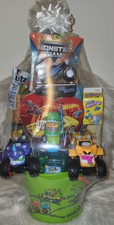 a basket filled with lots of toys on top of a white furnishing area