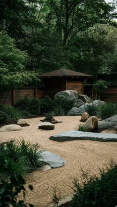 a garden with rocks and plants in it