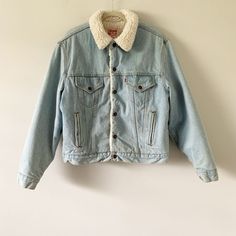 "Description: Vintage 90s Classic Levi's sherpa lined denim jacket made in USA. Condition:  Very good. (Small stain near hem pocket - Please see all pics) Measurements: Approx. Length: 25 1/4\" HPS, Chest (Flat across underarm): 24\", Sleeve length: 25 1/2\" ALL SALES FINAL - Please check and compare measurements to something you own before purchasing. Most of my products are vintage/used, so please check pictures and feel free to ask questions. Thank you." 90s Style Cotton Denim Jacket For Winter, 90s Long Sleeve Denim Jacket For Winter, 90s Light Wash Outerwear With Pockets, 90s Style Light Wash Outerwear With Pockets, Winter Retro Denim Jacket, Vintage Denim Jacket With Corduroy Collar For Winter, Retro Winter Denim Jacket With Pockets, Retro Denim Jacket With Pockets For Winter, Sherpa Lined Denim Jacket