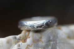 A beautiful and affordable ring featuring the meaningful Acanthus pattern.  The acanthus pattern has long symbolized rebirth, resurrection, and immortality which makes it so perfect for an engagement or wedding band. I created this one, and it's made with 14kt gold-filled metal.  It's 4mm wide and very sturdy.  Or you may choose the solid sterling silver version, also pictured. Any size. Gift boxed with a bow. What is 14kt Gold-filled metal, you ask?  14K Gold-filled metal is metal that has a thick layer of 14K gold bonded (with heat and pressure) over a base metal, like brass.   Your gold filled jewelry will last for years to come if you take care of it properly.  I acquire my gold filled wire from an American company which uses a 14-karat gold layer that meets the quality standards estab Acanthus Pattern, Simple Wedding Ring, Silver Ring Simple, Gold Knot Ring, Mothers Day Rings, Affordable Rings, Silver Wedding Band, Silver Rings Simple, Sterling Silver Wedding Band