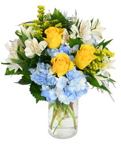 a vase filled with yellow roses and blue hydrangeas on top of a table