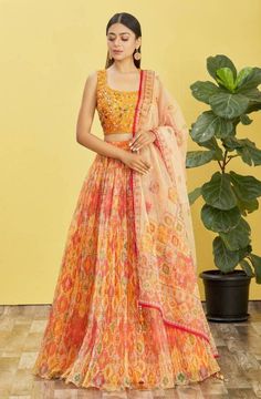 Add grace to your wardrobe with this gorgeous yellow embroidered organza lehenga set. The set includes a circular lehenga with threadwork embroidery, a matching choli, and an organza dupatta with beautiful embroidered details. Made from fine organza fabric and featuring intricate embroidered motifs  #yellowlehenga #yellowlehengas #yellowlehengacholi #yellowlehengadesigns #yellowlehengadress #designeryellowlehenga Yellow Mirror, Heavy Lehenga, Organza Bridal, Organza Lehenga, Organza Blouse, Salwar Dress