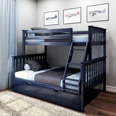 a bunk bed with drawers underneath it and pictures on the wall in the corner behind it