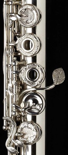 a close up of a silver musical instrument