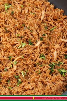 a bowl filled with rice and garnished with parsley