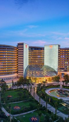 an aerial view of the hotel and casino at dusk, with lights on in the foreground