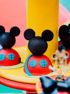 some mickey mouse cupcakes are on a plate