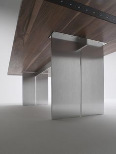 three stainless steel partitions in an empty room