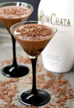 two martini glasses filled with chocolate pudding