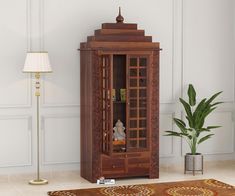 a tall wooden cabinet sitting next to a lamp on a rug in a living room