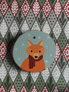 a painting of a fox with a scarf on it's head is hanging on a wall