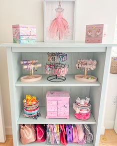 a white shelf filled with lots of toys