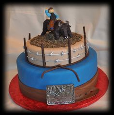 a birthday cake with a horse and rider on top