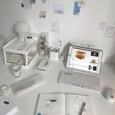 an open laptop computer sitting on top of a white desk