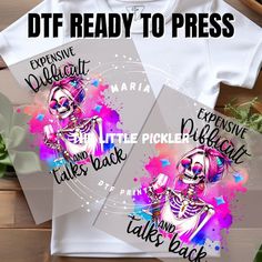 two t - shirts with the words, dtf ready to press and an image of a skeleton