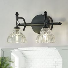 two light bathroom fixture with clear glass shades