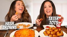 two women eating tater tots at a table