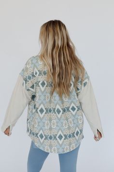 A true boho closet essential is the Tribal Blitz Jacket. This will become one of your go-to pieces to wear from season to season! Comfortable woven fabric with mix of solid corduroy and so cool print throughout Relaxed and loose jacket silhouette Classic collared neckline with a button-up front closure Loose long sleeves and convenient contrast front patch pockets Rounded bottom edge for added movement Perect boho layering piece! Pair with: Dora Low Back Seamless Bralette, On The Go V Neck Ribbe Boho Closet, Jacket Silhouette, Boho Essentials, Bralette Outfit, Loose Jacket, Boho Layering, Closet Essentials, Comfy Pants, New Tops