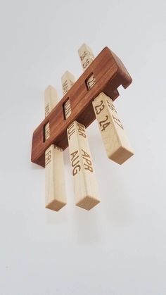 a wooden musical instrument that is hanging from the ceiling and has numbers on each side