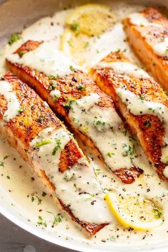 grilled salmon with lemon sauce in a pan