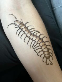 a person with a tattoo on their arm that has a large, black and white fishbone