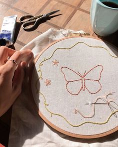 a person is working on a embroidery project