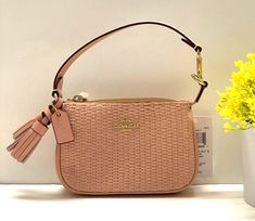 New with tag! 100% Authentic and Brand New Coach Nolita 15 In Straw Color: Gold/ Shell Pink Multi Style No.: CH215     * Product details Straw and smooth leather Two credit card slots Zip-top closure Fabric lining Handle with 4 1/2″ drop 6″ (L) x 4″ (H) x 1 1/2″ (W) Style No. CH215     IMTIV 195031868351 STRW LTH MIX NLT 15 10011205JAX Made in Myanmar Comparable Value: $188.00 * Shipping: This item is available and ready to ship out. The item is wrapped, packed carefully, and neatly with wrap pa Coach Bags With Wrist Strap And Rectangular Shape, Coach Nolita, Gold Evening Bag, Shell Pink, Coach Wristlet, Evening Clutch Bag, Zip Top, Clutch Purse, Cloth Bags