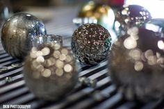 some silver balls sitting on top of a table