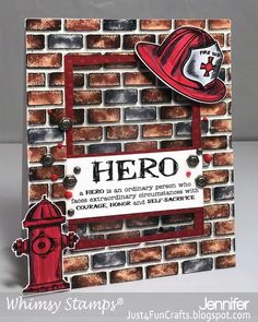 a red fire hydrant sitting in front of a brick wall with a sign that says hero