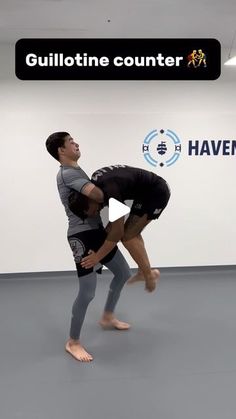 two men are performing an acrobatic move in front of a sign that reads gullitine counter