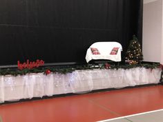 the table is covered with plastic bags and christmas decorations