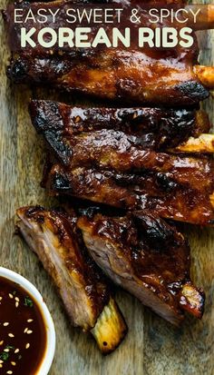 korean ribs on a cutting board with dipping sauce