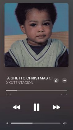 an mp3 player with a photo of a young child on it's screen and the caption reads, a ghettoo christmas c exxtentation