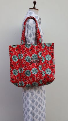 "cotton quilted  Jhola Bag made by Indian Artisans, this cotton quilted shopping bag is totally unique and multi purpose. Use this for your grocery or as a travel bag. Perfect to suit all. Size in Inch:- Height-19\" inch Width- 25\" inch Handle-11\" inch Size In CM:- 40x40x13 cm Handle height- 35 cm Material: 100% Cotton Pattern: Quilted Style: Ethnic Product Work: Printed & quilted Stitched Usage : Cosmetic, Make-up, Travel, Toiletries, Medicine, Accessories, Shopping and much more. Perfect for Bohemian Red Cotton Bags, Red Bohemian Cotton Bags, Eco-friendly Red Cotton Bag, Handmade Red Cotton Bags, Quilted Cotton Shoulder Bag For Daily Use, Diy Bags, Hippie Bags, Quilted Totes, Handmade Gift Wrap