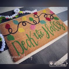 a door mat with the words hello new year on it and decorations around its edges